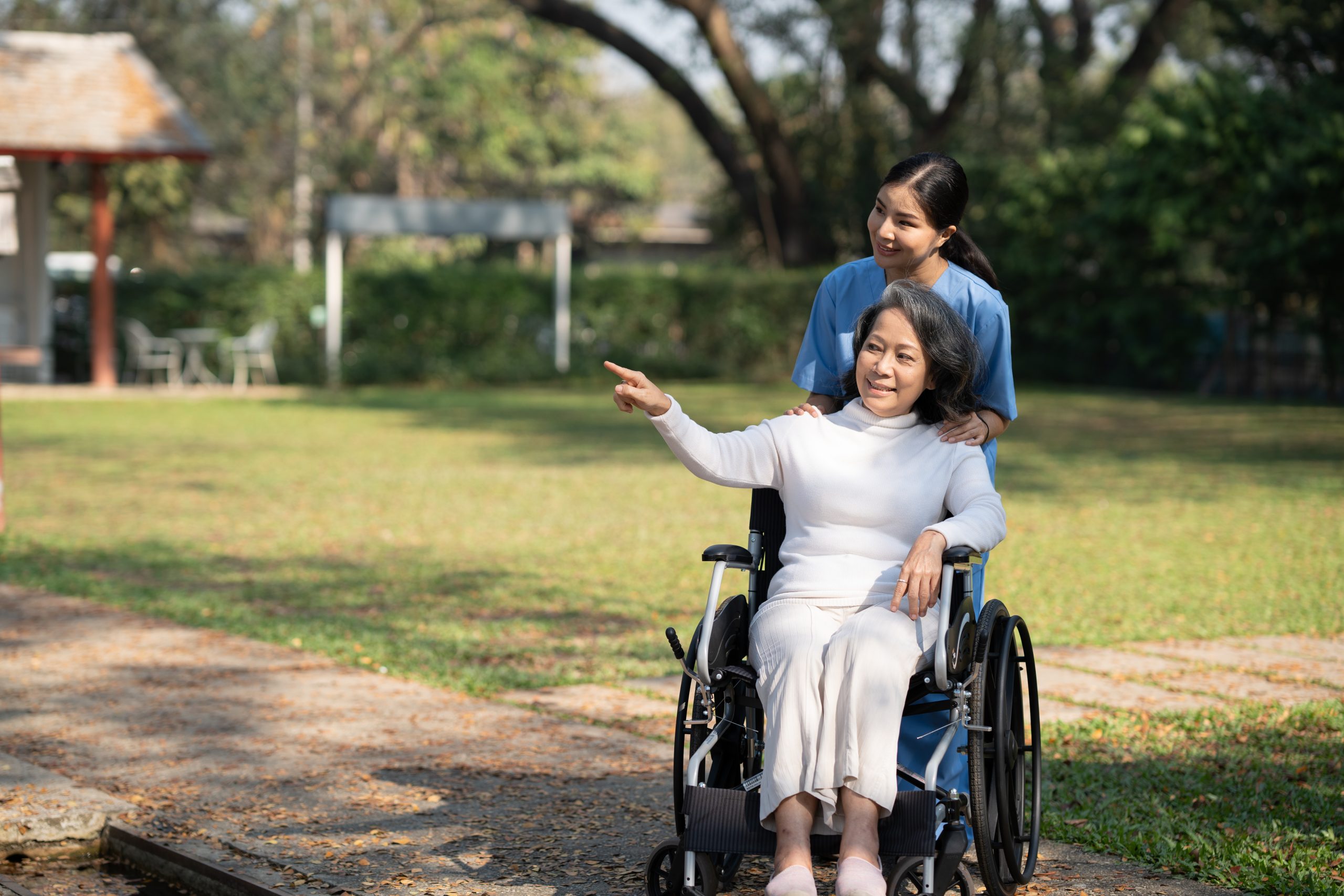 smiling senior woman enjoying a walk with caregive 2026 03 17 00 09 50 utc scaled