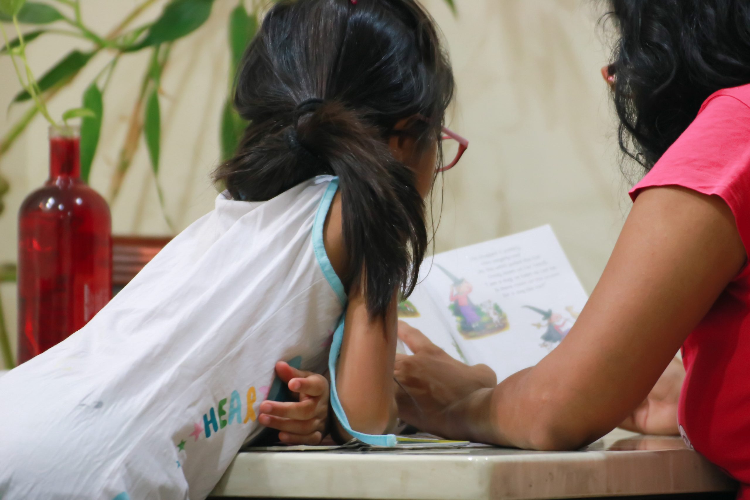child and woman reading a story book indoors 2026 03 09 05 00 14 utc scaled
